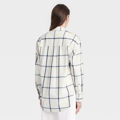 This Oversized Flannel Long-Sleeve Collared Button-Down Shirt from Universal Thread™ makes a versatile addition to your wardrobe. Made from midweight cotton, this collared shirt features a front button placket, long sleeves with buttoned cuffs, a patch pocket on the chest and a box-pleat back yoke for classic touches. The oversized fit and shirttail hemline complete the design, allowing you to wear it tucked in, untucked, layered open and unbuttoned, or with rolled-up sleeves. Universal Thread™: Oversized Flannel, White Plaid, Shop Blouses, A New Day, Casual Fits, Recycled Cotton, Sleeve Styles, Women Long Sleeve, Shirt Blouses