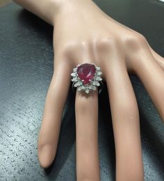 7.90 Carats Impressive Natural Red Ruby and Diamond 14K White Gold Ring Suggested Replacement Value $6,200.00 Total Natural Red Ruby Weight is: Approx. 7.00 Carats (lead glass filled) Ruby Measures: Approx. 14.20 x 10.70mm Natural Round Diamonds Weight: Approx. 0.90 Carats (color G-H / Clarity SI1-Si2) Ring total weight: Approx. 5.8 grams Disclaimer: all weights, measurements and colors are approximate and may vary slightly from the listed dimensions or as seen in the image. All pictures are mag Luxury Red Cluster Diamond Ring, Formal Oval Ruby Ring In Platinum, Oval Ruby Ring In Platinum For Formal Occasions, Formal Platinum Gemstones Fine Jewelry, Formal Ruby Gemstones, Exquisite Formal Gemstones With Prong Setting, Exquisite Gemstones With Prong Setting For Formal Occasions, Fine Jewelry Platinum Gemstones For Formal Occasions, Gia Certified Gemstones For Formal Occasions