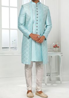 Readymade Art Silk Sherwani, and Jacket. Art Dupion Aligarhi Ready Made Trouser. Resham, Sequences, and Zari Work. Crafted in Chinese Collar Neck, and Full Sleeve. Faux Satin Lining with Plain Work. High-Quality Matching Buttons. Please Note: The footwear shown in the picture is for presentation and photography purpose only. Color: There might be slight color variation due to lightings and flashes while photo shooting. The color may also vary because of different screen resolutions. Wash Care: D Festive Long Fitted Outerwear, Traditional Fitted Long Coat, Fitted Long Outerwear For Festive Season, Fitted Outerwear With Resham Embroidery For Transitional Season, Traditional Long Coat For Festive Season, Fitted Long Nehru Jacket For Winter, Bollywood Style Fitted Outerwear With Resham Embroidery, Formal Festive Sets With Front Open, Long Sleeve Suits With Resham Embroidery For Festive Occasions