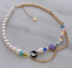 "ITEM DETAILS: * Material: 18k Gold Filled Chain Freshwater Pearl Multicolored Beads Gold Heart Beads Face Round Beads Nickel Free Hypoallergenic * Size Chain: 15\" + 2\" Extension Each Necklace is Handmade 💕 There are slight variations in the colors. If you have any suggestions, just let me know in a message and I will try to do my best according to availability at the time of order. * Shipment: Everything Is made to order. Order preparation may tak 3 To 5 business day. * Packaging: The jewels Yin Yang Necklace, Necklace Y2k, Y2k Necklace, Horoscope Necklace, Beaded Necklace Diy, Gold Filled Necklace, Chunky Beads, Necklace Pearl, Beaded Accessories