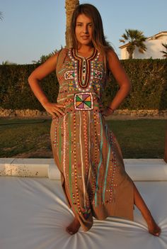 This beautiful dress is 100% Bedouin hand embroidered. It is the perfect dress for your summer party or night out. This dress is hand stitched by a group of 3 girls in the Sinai peninsula of Egypt, and takes around two weeks to make. The dress is made of Egyptian Cotton which is widely renowned for its quality and texture. Material : 100% Egyptian cotton -----Small------ Bust : 35-36 inches Hip : 43-44 inches -----Medium---- Bust : 38-39 inches Hp : 46-47 inches -----Large---- Bust : 42-43 inche Multicolor Embroidered Tunic Dress For Festivals, Multicolor Maxi Length Embroidered Dress For Festivals, Multicolor Maxi Length Kaftan With Resham Embroidery, Bohemian Sleeveless Dress With Resham Embroidery, Multicolor Resham Embroidered Maxi Kaftan, Multicolor Resham Embroidery Maxi Length Kaftan, Multicolor Sleeveless Dress With Resham Embroidery, Embroidered Cotton Maxi Dress For Beach, Bohemian Dresses With Embroidered Border For Festivals