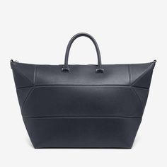 a black leather tote bag on a white background