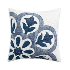 a blue and white pillow with flowers on it