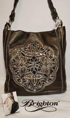 BRIGHTON ANJU PEWTER MASTERPIECE COL. SHOULDERBAG PURSE JEWELED.THIS IS A BEAUTIFUL BAG . •HIGHT 12" •WIDTH 12" •DEPTH 4" •STRAP DROP 10.5" BRIGHTON  ANJU MASTERPIECE PEWTER BEADED EMBELLISHED SOFT LEATHER BAG   FROM BRIGHTON MASTERPIECE COLLECTION   COLOR IS PEWTER WITH SILVER TONE HARDWARE   BEAUTIFUL BEADED JEWELS IN FLORAL SHAPE ON FRONT   EXTERIOR HAS SLIP POCKET NICE SOFT LEATHER WITH BRAIDED STRAP WITH A 10 1/2" STRAP DROP MAGNETIC CLOSURE INTERIOR HAS 2 ZIPPER COMPARTMENTS & 2 SMALL SLIP Formal Embellished Shoulder Bag, Luxury Silver Hobo Shoulder Bag, Silver Hobo Bag With Silver-tone Hardware For Evening, Luxury Embellished Silver Bags, Everyday Glamorous Embellished Shoulder Bag, Glamorous Embellished Shoulder Bag For Everyday, Glamorous Embellished Shoulder Bag For Everyday Use, Formal Silver Embellished Shoulder Bag, Silver Embellished Bag For Everyday Use