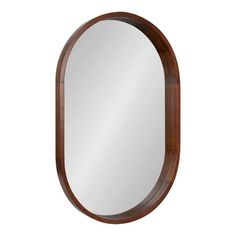 an oval wooden mirror on a white background