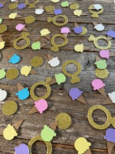 the table is covered with paper cutouts and confetti