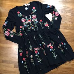 There Is Just Something About This Dress! Wow Is It Gorgeous. It Is Black With Floral And Bird Embroidery With A Slight Ho Lo Hemline. It Is A Size Small And Measures As Follows Armpit To Armpit 18 Inches Shoulder To Shoulder 15 Inches Shoulder To Wrist 23 Inches Shoulder To Waist 17 Inches Waist To Hem 17 Inches In Front. Multicolor Embroidered Long Sleeve Floral Dress, Fall Long Sleeve Dresses With Multicolor Embroidery, Fall Dresses With Multicolor Embroidery And Long Sleeves, Fall Long Sleeve Embroidered Dresses, Fall Multicolor Embroidered Long Sleeve Dress, Casual Mini Embroidered Dress With Floral Print, Casual Embroidered Floral Mini Dress, Spring Long Sleeve Dress With Multicolor Embroidery, Spring Multicolor Embroidered Long Sleeve Dress