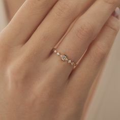 Material: Gold Carat: 14K (585) Solid Gold 14k Gold Baguette Diamond Ring, Minimal Baguette Wedding Ring, Baguette Diamond Ring, Dainty Diamond Ring, Minimalist Engagement Ring   Ring Details * 14k Solid Gold Ring * Baguette Total Carat: 0.05ct (1 piece) * Round Stone Carat: 0.06ct (6 piece) * Total Carat: 0.11 ct * Diamond Quality: G Colour VS1 Clarity * Total Numbers Of: 7 14K Solid Gold Plated is not gold it is real solid gold Gold Color Options; Yellow Gold, White gold, Rose Gold, - All prod Minimalist Baguette Cut Diamond Ring With Rose Cut, Minimalist Stackable Wedding Rings With Baguette Diamonds, Minimalist Stackable Wedding Rings With Baguette Cut, Minimalist Baguette Cut Stackable Wedding Rings, Minimalist Stackable Baguette Cut Rings For Wedding, Minimalist Baguette Cut Stackable Rings For Wedding, Wedding Stackable Rings With Baguette Diamonds In 14k Gold, 14k Gold Baguette Diamond Stackable Rings For Wedding, Delicate 14k Gold Baguette Cut Ring