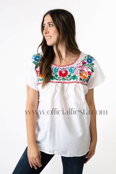 Mexican Embroidered Pueblo Blouse - White  These fabulous blouses feature a unique colorful embroidered pattern. These embroidered blouses are also commonly known as Mexican Peasant Blouse Tops.  Please note that each blouse is individually hand embroidered so the embroidery design will vary from the one pictured. You will receive the blouse color selected. White Peasant Embroidered Top With Embroidered Border, White Peasant Top With Embroidered Border, White Embroidered Folk Peasant Top, White Peasant Blouse With Embroidered Border, White Short Sleeve Blouse With Embroidered Sleeves, White Blouse With Embroidered Short Sleeves, White Peasant Top With Embroidered Neckline, Peasant White Embroidered Blouse, White Embroidered Short Sleeve Blouse