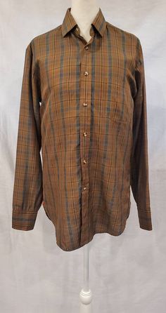 "A nice simple plaid men's silk dress shirt - perfect for dressing up or down. -1960s / 1970s -Private Stock -Fabric - Silk -Buttons up the front / High neck button -Long Sleeve with button cuff ( one button ) -Left side open pocket -This is in good condition except the neckline that has a few fabric scratches ( see pictures ) Measurements: Chest: 40\" Sleeve length from shoulders to wrist: 25\" Shoulders seam to seam: 16\" Length from shoulders to hem: 29\"" Fitted Plaid Flannel Shirt With Spread Collar, Brown Shirt With Buttons For Daywear, Brown Buttoned Shirt For Daywear, Formal Plaid Shirt For Fall, Classic Plaid Shirt For Daywear, Vintage Long Sleeve Business Shirt, Fitted Vintage Plaid Shirt, Vintage Fitted Plaid Shirt, Vintage Fitted Business Shirt