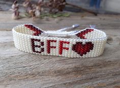 "Beaded loom bracelet with heart and inscription BFF. This hand woven wristband can be a small gift that will inform or remind a dear person of your love and frienship. Seed bead bracelet is a great gift for a  best friend , girlfriend, girl or daughter for Valentine's Day, Birthday, Christmas and other holidays. Such beige beads bracelet is suitable for daily wear. READY TO SHIP! If you need a bracelet in a different color, please let me know and it will be custom made within 1-3 days. A person Cute Beaded Friendship Bracelets For Valentine's Day, Valentine's Day Friendship Bracelets With Letter Beads, Valentine's Day Letter Beads Friendship Bracelets, Heart-shaped Letter Beads Friendship Bracelets As Gift, Trendy Handmade Friendship Bracelets For Mother's Day, Handmade White Friendship Bracelets For Mother's Day, Customized White Friendship Bracelets Best Friend Gift, Valentine's Day Letter Beads Friendship Bracelets For Best Friend, Customized White Friendship Bracelets For Best Friend Gift