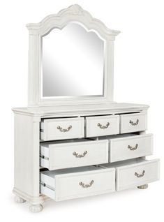 a white dresser with drawers and a mirror