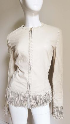 For Sale on 1stDibs - A fabulous soft, supple, off white leather jacket from Gianni Versace. It is fitted with vertical seaming which is highlighted with intricate braiding White Leather Jacket, Fringe Leather Jacket, Gianni Versace, White Leather, Versace, Leather Jacket, Lace Up, Off White, Lace