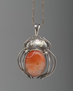 Orange Sardonyx Pendant Symbolic Jewelry With Large Oval Pendant, Symbolic Large Oval Pendant Jewelry, Unique Pendant Locket Jewelry, Symbolic Pendant Locket Jewelry, Symbolic Locket Pendant Jewelry, Oval Large Pendant Jewelry Gift, Unique Round Pendant Locket Jewelry, Gift Jewelry With Large Oval Pendant, Collectible Locket Pendant Necklace