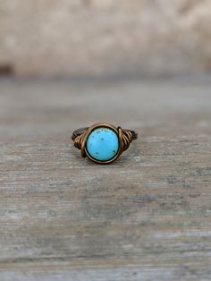 Urban boho wire Wrapped Ring Made with a 10mm Turquoise magnesite gemstone coin bead. The ring is wrapped with 18 gauge non tarnish wire. Your choice of antique brass or silver plated wire. Rings are made to order in your size. Ring may appear larger in photos to show detail. Since each ring is handmade and gemstones vary in color tone and pattern, there may be slight differences in each ring. Your order will be made and shipped within 1-5 business days of received payment. Returns and exchanges Boho Turquoise Ring, Urban Boho, Boho Turquoise, Casual Rings, Ring Wire, Turquoise Boho, Blue Stone Ring, Boho Style Jewelry, Bohemian Rings