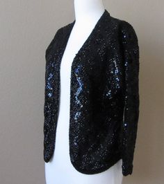 "Vintage 1950s/60s Italian Couture Laura Aponte Black Sequined 100% Pure Wool Cardigan/Jacket, ¾ Sleeves Every time I look at this I think of Liza Minnelli! I found this item zipped up in a vinyl pouch at an estate sale. It is truly stunning. 100% pure wool in black fully adorned in black sequins in a diamond pattern. In excellent vintage condition. Laura Aponte designed for Schiaparelli before starting her own couture house in Italy sometime in the 50s. Some of her designs are currently held as Italian Couture, Vinyl Pouch, Liza Minnelli, Couture Vintage, The 50s, Pin Up Style, Women Crop, Wool Cardigan, Couture Collection