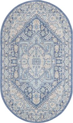 a blue and white rug with an intricate design on the center, in a circular shape