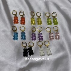 ✨ Add a pop of color to any outfit with our gummy bear dangles. They look so good you almost want to eat them! (non-edible)  ✨PRODUCT  * resin made  * leverback earring hook  * Hypoallergenic, suitable for various skin types  * Safe material, wear more at ease  * Moderate hardness, not easy to bend  ✨IMPORTANT  Earring hooks may be changed upon request with a message after purchase. Second earring hook option will be changed as a regular hook instead of lever back (shown in picture) Item will not be changed unless made upon request.  ✨JEWELRY CARE  * avoid getting wet & keep away from moisture  * when not in use store in jewelry box  * avoid direct contact with perfume  * remove before sleeping & active  * clean & polish with soft cloth  ✨freebies included with any order Second Earring, Gummy Bear Earrings, Bear Earrings, Flower Shoes, West Covina, Red Rose Flower, Earring Hook, Croc Charms, Gummy Bear