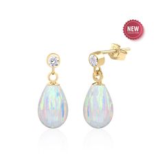 Sure to make heads turn, these opal earrings feature 12x8 mm Kyocera created white opal teardrops  dangling from white topaz accented stud earrings. Drop length is 0.7 inches. Available in 14K Gold Filled and Sterling Silver. An enchanting play of colors coupled with the opulence of gold. Subtle sparkle - perfect for everyday and occasion wear. The perfect wedding jewelry for a bride who prefers something simple yet stunning for her big day. Surprise mom, wife or mother in law with a Mothers Day Formal Opal Gemstone Earrings, Pear-shaped Opal Jewelry For Formal Occasions, Formal Opal Pear-shaped Jewelry, Formal Pear-shaped Opal Jewelry, Opal Jewelry In Yellow Gold With Matching Earrings, Yellow Gold Opal Jewelry With Matching Earrings, White Opal Jewelry With Matching Earrings, White Pear-shaped Opal Jewelry, Opal Earrings For Anniversary - Fine Jewelry