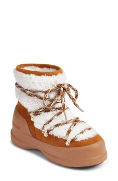 Inspired by traditional hiking styles, this suede boot boasts cloud-like genuine shearling and multicolored laces with gleaming goldtone hardware for added style points. 1 1/4" heel 9" shaft Lace-up style Water repellent Removable, cushioned insole with arch support Leather and genuine-shearling (Italy) upper/leather lining/rubber sole Made in Spain Shearling Boots Woman, Boots Cognac, Moon Boot, Sheep Skin, Hiking Fashion, Italian Shoes, Shearling Boots, Ankle Boots Flat, Moon Boots