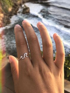 * Welcome to my shop. I sell slow jewellery for the slow traveller  * The 'ULU' Wave Ring ~ handmade using 925 sterling silver. The simple wave ring wraps around your finger in this Bali tropic design. Inspired by Uluwatu, the perfect place for a swim on a slow beach day.  Each ring is handmade by Made with the help from her family. I met her at silver jewellery making workshop in Ubud back in 2018. She showed me her amazing skill which has been passed down her family for generations and so I decided to start the brand to support Made's work and the local community. She sets the price I pay which means each piece was fairly traded. The rings are handmade in small batches, one by one over a few months resulting in better quality and less waste.  Reducing waste is important to me. Each ring Wave Ring Silver, Ring Wraps, Jewelry Making Workshop, Valentines Gift For Her, Handmade Silver Jewellery, Silver Ring Designs, Artisan Rings, Wave Ring, How To Make Rings