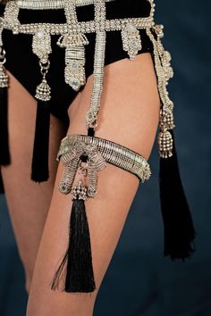 Amaya Garter Band is constructed with stainless steel beads and detailed with hand cut mirror clusters. The band is fully lined by hand in luxurious velvet and is adjustable at back to comfortably fit to your thigh circumference. This garter band can be worn with or without the removable tassel. Adjustable logo slider at back is made of stainless steel and is 100% hypoallergenic. CUSTOM: * For custom sizes, please contact us directly. We love to accommodate all shapes and forms. ULTIMATE QUALITY Gold Garter, Velvet Bra, Nickel Allergy, Stainless Steel Plate, Shape And Form, Bra Straps, Miu Miu Ballet Flats, Metal Beads, Get Dressed