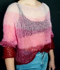 "The pink loose fit sweater features a hand-knitted soft texture with long sleeves. Incredibly soft, enveloping like a cloud will give a feeling of comfort and coziness. Yarn composition: 30% kid mohair, 70% polyamide. Sweater length off shoulder 60 cm (23.6\"), width 55 cm (21.6\"), long sleeve 70 cm (27.5\") Size: S/L Model's height is 5.6 ft. Chest circumference 37.4\" Hand wash with shampoo is recommended." Handmade Long Sleeve Pink Sweater, Pink Mohair Sweater For Fall, Cozy Handmade Pink Knitting Pattern, Handmade Pink Long Sleeve Sweater, Handmade Cozy Pink Knitting Pattern, Pink Hand Knitted Long Sleeve Sweater, Pink Mohair Sweater For Winter, Pink Mohair Sweater, Hand Knitted Pink Mohair Sweater