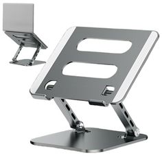 a laptop computer sitting on top of a metal stand with a hole in the middle