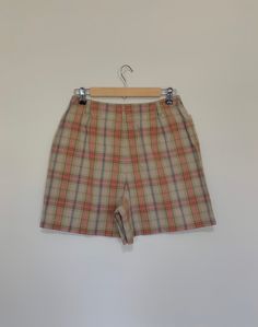 "Awesome high waisted 90's plaid shorts. High waisted fit, looser through the hips, and two front pockets. Button and zipper closure in front. Classic 90's multi colored plaid pattern. Shorts are in excellent clean condition. Measurements are taken zipped or buttoned up and laid comfortably flat then x 2 for total circumference (inches) Liz Claiborne Tag Size 10 100% Cotton Waist 28\" Hips 42\" Length 16.5\" Inseam 5\" Rise 12\" Bottom leg Opening Circumference 26\" All items are free of rips, t 90s Style Shorts With Belt Loops, Plaid Short Bottoms For Fall, Fall Plaid Shorts, Retro High Waist Shorts With Belt Loops, Retro High-waisted Shorts With Belt Loops, High Waist Plaid Summer Bottoms, Retro Shorts With Belt Loops, Vintage Plaid Bottoms For Summer, Vintage Plaid Summer Bottoms