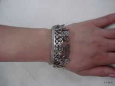 "Vintage Antique ethnic collectible very nice tribal old silver charm Bracelet or bangle pair from Rajasthan India. Worn by Banjara tribal people of Rajasthan. Beautiful workmanship all over the piece, adorn with silver charms. One quarter-hinged part can be open by pin. Original old pair in good condition with great antique look. great pair for jeweley collection. Inner diameter across - 5.3 cm(2\") Inner circumference -16.6 cm (6.5\") width include charms - 2.6 cm(1\") weight for pair - 92.5 g Bohemian Antique Silver Bangle With Oxidized Finish, Silver Oxidized Bangle For Festival, Silver Bangle With Oxidized Finish For Festival, Silver Metal Bohemian Cuff Bracelet, Silver Bohemian Metal Cuff Bracelet, Bohemian Silver Metal Cuff Bracelet, Bohemian Antique Silver Metal Bangle, Bohemian Oxidized Silver Cuff Bracelet, Bohemian Silver Cuff Bracelet With Oxidized Finish