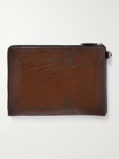 This pouch has been crafted in Italy from Berluti's 'Venezia' leather and inscribed with a signature 'Scritto' motif. Sized for documents, it's fully lined in twill and features a slip pocket inside to tuck business cards. Designer Embossed Formal Bag, Designer Formal Bag With Embossed Details, Designer Formal Embossed Bags, Designer Embossed Bags For Formal Occasions, Designer Leather Pouch For Gifts, Luxury Leather Embossed Wallets, Luxury Embossed Leather Wallet, Luxury Envelope Pouch, Designer Leather Pouch For Formal Use