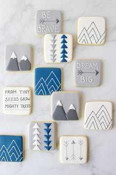 decorated cookies with words and mountains on them