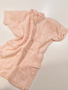 Beautiful vintage angora lambswool blend short sleeve sweater shirt with high neck in pretty pale pink color with Pearl details on neckline  Size Medium (Fits modern Small/Medium best) Zipper down half back / pullover  Perfect vintage condition  Can be dressed up or down  Great for holiday parties or a ballet core look!  Pair pale pink sweater top with mom jeans ballet flats and a hair ribbon for a chic Parisian look Pink Winter Tops For Daywear, Beige Short Sleeve Sweater For Spring, Pink Tops For Winter Daywear, Pink Winter Daywear Tops, Cream Short Sleeve Tops For Winter, Chic Short Sleeve Beige Sweater, Elegant Short Sleeve Sweater For Spring, Cozy Short Sleeve Spring Sweater, Spring Cozy Short Sleeve Sweater