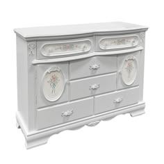 a white dresser with flowers painted on the front and drawers, all in different colors