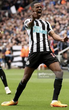 a soccer player celebrates after his goal during the match between newcastle and manchester city at st james's park