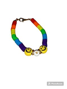 Rainbow bracelet, for women, bracelet for kid, bracelet for teens, vibrant bracelet, smiley face charms, stretchy bracelet, gold heart charm. My bracelets are made from high quality clay beads strung around an elastic jewelers band, closed with a hinged clip that is small, and fashionable. This vibrant rainbow bracelet is perfect for a vibrant person. Playful Charm Bracelet For Friendship, Playful Heart Beads Stretch Bracelet For Friendship, Fun Friendship Bracelets With Heart Beads, Playful Heart Beads Bracelet, Playful Smiley Face Jewelry For Friendship, Playful Stretch Bracelet With Smiley Face For Gift, Playful Smiley Face Stretch Bracelet As Gift, Fun Smiley Face Bracelets, Fun Gold Beaded Bracelets