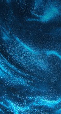 an abstract blue background with bubbles and stars