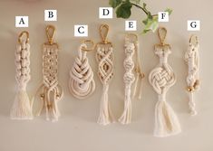 several different types of tassels are shown on a white surface with the letters abc, df and fg