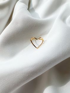 Heart shaped minimal ring. Carry your love with you at all times! Note: Ring is made for size 5.5, but can be resized for free. If you are not the same size as specified and would like to purchase, please purchase and we will reach out to confirm size. Resizing takes 3-4 weeks. Made in 18k Solid Gold. Dimensions: Heart height is 1cm tall, while width is 1.5cm. Minimalist Open Heart Ring For Gift, Minimalist Rings For Valentine's Day, Minimalist Open Heart Ring Gift, Minimalist Open Heart Midi Rings For Anniversary, Minimalist Heart-shaped Rings, Minimalist Open Heart Ring, Modern Heart-shaped Ring For Everyday Wear, Modern Everyday Heart Ring, Modern Everyday Heart-shaped Ring