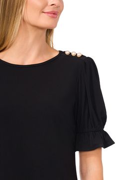 Decorative pearly buttons at the shoulder charm this easy crepe-knit top framed by lightly puffed sleeves with fluttery ruffle cuffs. 23 1/2" length Jewel neck Elbow-length sleeves 95% polyester, 5% spandex Machine wash, line dry Imported Elegant Puff Sleeve Top With Buttons For Work, Elegant Puff Sleeve Top With Ruffles, Elegant Puff Sleeve Top With Ruffle For Work, Elegant Puff Sleeve Top With Ruffle And Gathered Sleeves, Jewel Neck, Puffed Sleeves, Elbow Length Sleeve, Knit Top, Puff Sleeve