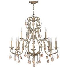 an antique chandelier with crystal drops hanging from it's center and sides