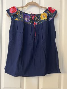 This Beautiful Off the Shoulder Blouse  is the perfect for a fun day out or stay home.  It's made out of cotton manta has an elastic waist and is full of vibrant embroidered florals.  This blouse comes in size S -L   All the blouse are final sale  Unique Colors and embroidery as showed in the pictures. Spring Beach Blouse With Boho Collar, Casual Embroidered Top With Boho Collar For Spring, Summer Bohemian Blouse With Boho Collar, Summer Vacation Blouse With Boho Collar, Peasant Style Embroidered Top For Beach, Casual Embroidered Cotton Blouse, Casual Cotton Embroidered Blouse, Bohemian Blouse With Boho Collar For Summer, Bohemian Peasant Top For Summer Festival