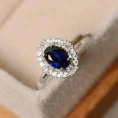 Sapphire ring lab sapphire oval sapphire ring sterling | Etsy Blue Saffire Jewelry, Classic Oval Sapphire Halo Ring, Classic Oval Sapphire Ring With Halo Design, Elegant Oval Halo Ring With Lab-created Sapphire, Oval Sapphire Promise Ring, Oval Sapphire Ring With Halo, White Gold Oval Sapphire Ring, Fine Jewelry Oval Lab-created Sapphire Ring, Elegant Sterling Silver Sapphire Ring With Halo