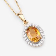 14K Gold Yellow Sapphire Pendant, Genuine Yellow Sapphire and Diamond Pendant Necklace, September Birthstone, Bridal Sapphire Pendant Bright, beautiful colors make this halo pendant into a one-of-a-kind statement piece you'll love. Our 1.78 ct. t.w. oval genuine yellow sapphire pendant necklace is set in polished fine finish 14k yellow gold for a divine look at a smart price. Yellow sapphire is a stunning gemstone that has a deep and rich yellow color. It is also very durable and resistant to sc Yellow Multi-stone Fine Jewelry, Yellow Gemstones With Accents Fine Jewelry, Gold Diamond Pendant Gemstone, Gold-tone Diamond Pendant, Dazzling Yellow Gold Jewelry With Stones, Yellow Gold Citrine Oval Pendant Jewelry, Yellow Gold Necklace With Jeweled Round Pendant, Yellow Gold Necklace With Jewels In Round Pendant, Elegant Multi-stone Oval Pendant Necklace