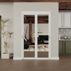 an open kitchen and living room with sliding glass doors