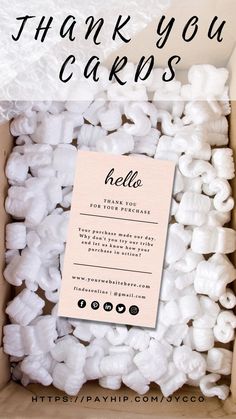 a box filled with white marshmallows and the words thank you cards written on it