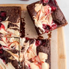 some brownies with white chocolate and cherries on them