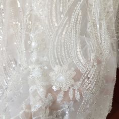 3D Beaded Geometric Silver Sequin lace Fabric on Light Champagne Tulle ,Wedding Dress Bridal Lace Fabric by Yard So many detaield beads, sparkle sequins making this top quality haute couture fabric , tulle is light champagne color Width is about 140cm , price is for one yard more buying will be cut as one piece my shop link: http://www.etsy.com/shop/lacetime ------------------------------------------------------ ---------------------------------------------------------------- ------------------- Lace Tulle Fabric With Sequins For Wedding, Embellished Tulle Fabric For Wedding, Embellished Lace Wedding Gown, Wedding Lace Gown Embellished, Tulle Wedding Dress With Lace Work, Wedding Tulle Lace Fabric With Pearl Embroidery, Wedding Tulle Fabric With Pearl Embroidery, Wedding Tulle Lace With Scalloped Edges, Wedding Tulle Lace With Scalloped Detail