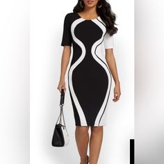 In Black And White With A Geometric Colorblock Design, This Sheath Dress Is The Epitome Of Modern Elegance. Team It With Heels And You're Ready For The Office. Crewneck. Short Sleeves. Sheath Silhouette. Geometric Colorblock Design. White Fitted Dress With Splicing Details, Black Fitted Midi Dress With Splicing, Fitted Black Midi Dress With Splicing, Fitted White Dress With Splicing Detail, Elegant Spliced Midi Dress, Fitted Midi Dress With Splicing, Fitted Splicing Midi Dress, Elegant Midi Dress With Splicing, Elegant Bodycon Dress With Splicing Details