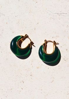 Introducing our enchanting A Thousand Island Earrings - a mesmerising homage to the lush beauty of nature, crafted with the finest deep green emerald. These curve-shaped earrings with mini gold hoops are wearable treasures inspired by the verdant islands, the tranquillity of a hidden paradise, and the timeless allure of nature's wonders. Material: Stainless Steel Waterproof: Yes Hypoallergenic: Suitable for sensitive skin Durability: Non-tarnish Each of our products is beautifully packaged in an Modern Green Round Earrings, Green Teardrop Hoop Earrings For May Birthstone, Modern Green Round Hoop Earrings, Small Hoop Earrings For May Birthstone, Elegant Green Hoop Earrings, Elegant Green Pierced Hoop Earrings, Green Pierced Hoop Earrings, Modern Green Earrings For Anniversary, Elegant Green Hoop Earrings Pierced